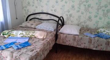 Фото номера Стандартный двухместный номер с 1 кроватью или 2 отдельными кроватями Гостевой дом у Одиссея г. Ольгинка 4
